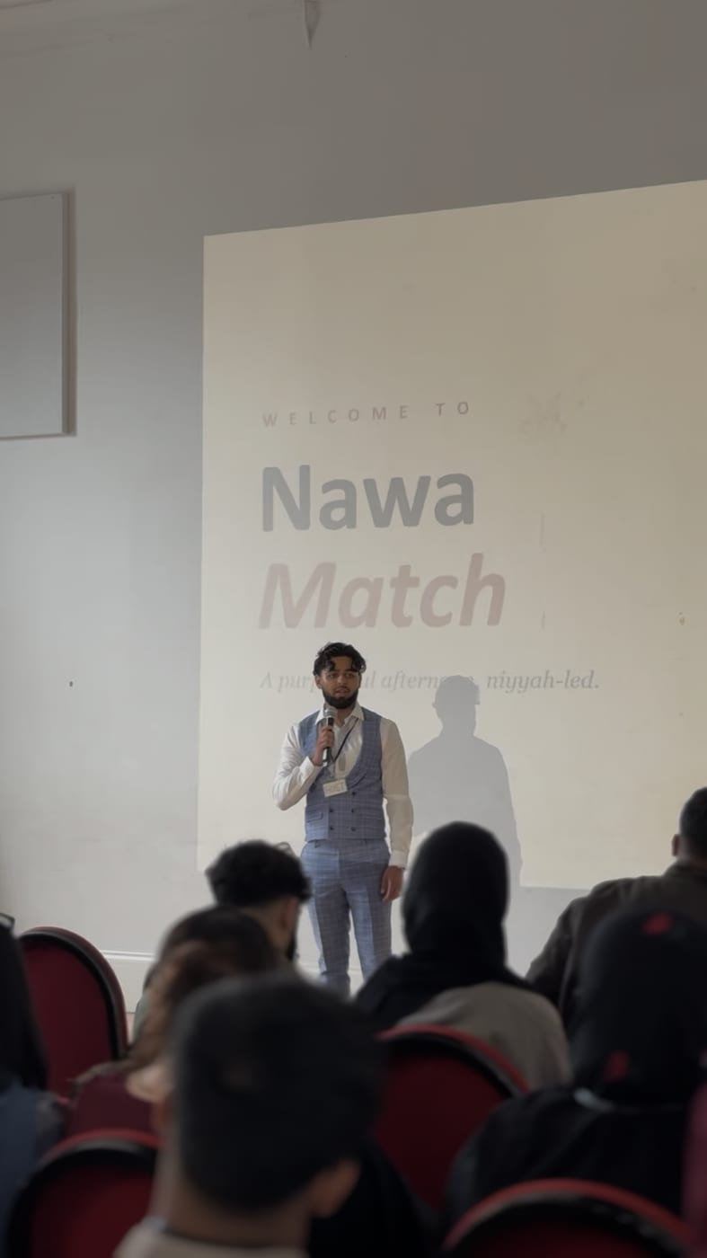 A speaker addressing attendees at a Nawa Match event
