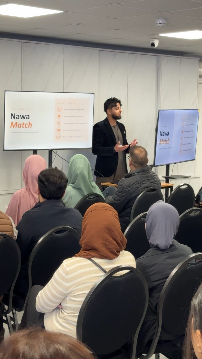 A Nawa Match team member welcoming attendees at an event